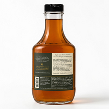 Load image into Gallery viewer, Shagbark Hickory Syrup 32 oz decanter bottle with a gold wax dipped cap, green and cream Arbor and Field Label on the back with pairing suggestions and a description of how the product is crafted. Clean white background, premium look and feel.