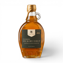 Load image into Gallery viewer, Shagbark Hickory Syrup 8 oz flask bottle with green and cream Arbor and Field Label on the front, a gold wax dipped cap and a handwritten gold batch number. Clean white background, premium look and feel.