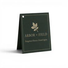 Load image into Gallery viewer, Dark green gift tag with cream 'Arbor and Field' logo with leaf emblem and "Forgotten Flavors. Found Again." tagline underneath. Clean white background, premium look and feel.