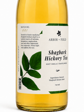 Load image into Gallery viewer, Bottle of Arbor and Field Shagbark Hickory Tea with a label on a white background
